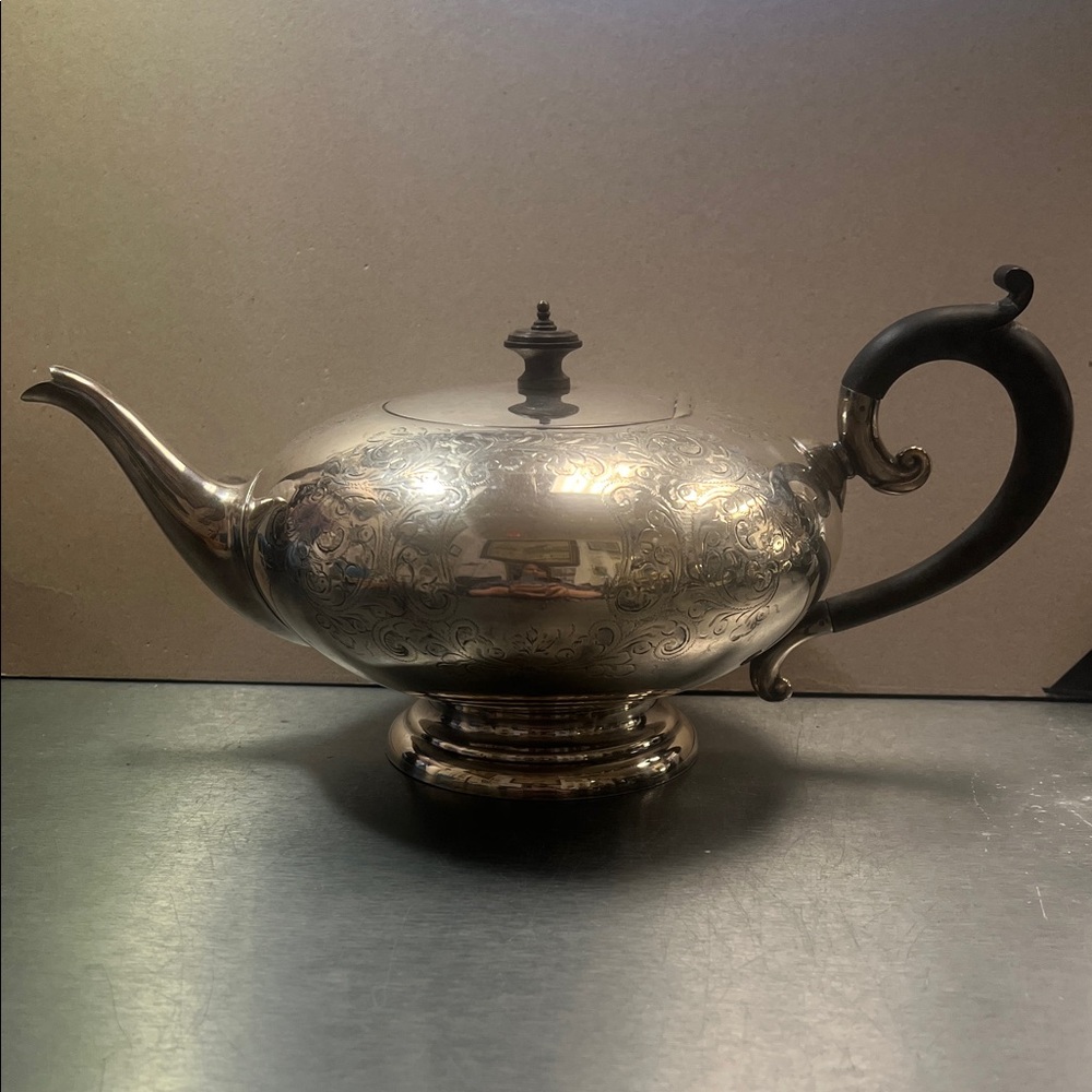Elegant Silver Teapot with Black Handle England